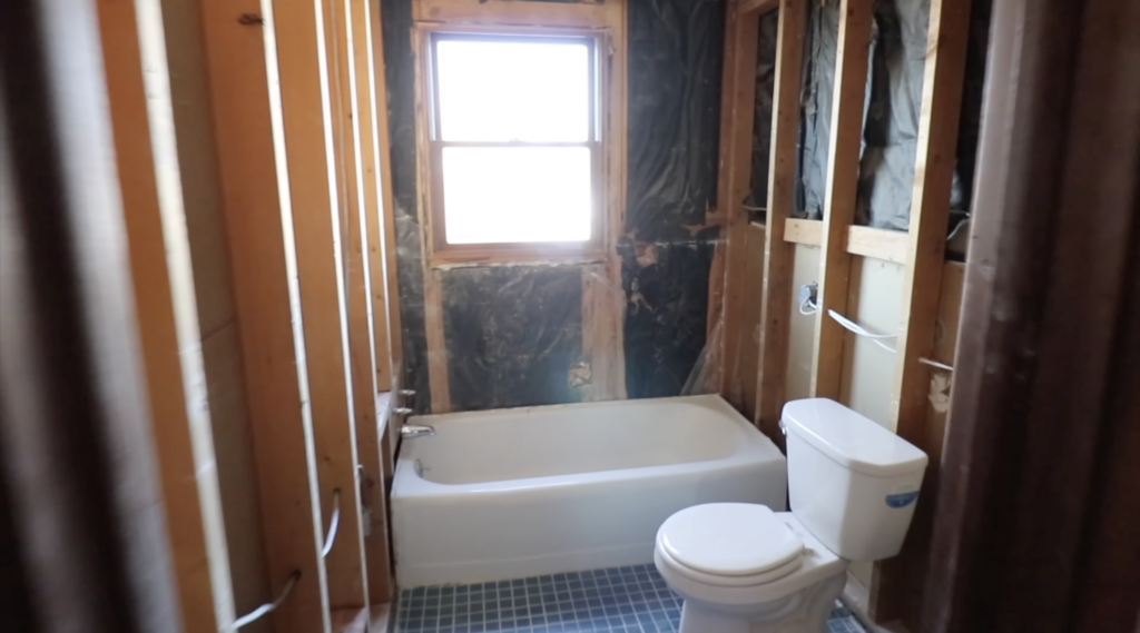 The bathroom completely gutted before hanging drywall by yourself 